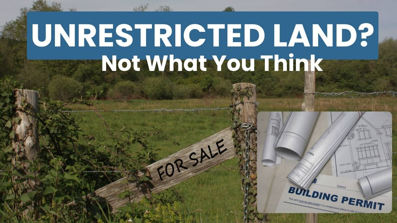 Unrestricted land for sale sign contrasted with building permits and zoning paperwork